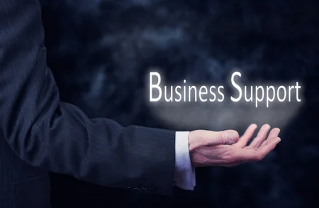 29039638-a-businessmans-hand-holding-the-words-business-support-